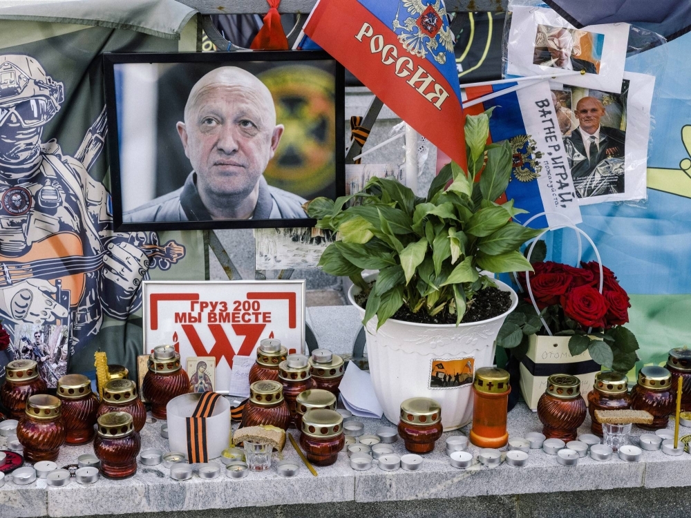 An impromptu memorial for Yevgeny Prigozhin, the head of the Wagner mercenary group who died in a plane crash in Russia, in Moscow on Aug. 27. A shadowy fight is playing out on three continents for control of Prigozhin's sprawling interests as head of Wagner.
