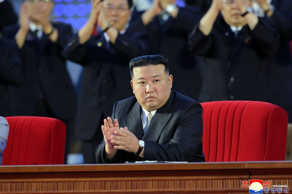 North Korean leader Kim Jong Un attends the central report conference at the Mansudae Assembly Hall in Pyongyang to mark the 75th founding anniversary of the country, in this image released Saturday.