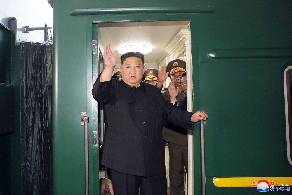 North Korean leader Kim Jong Un waves as he departs by train from Pyongyang for a visit to Russia in this image released Tuesday.
