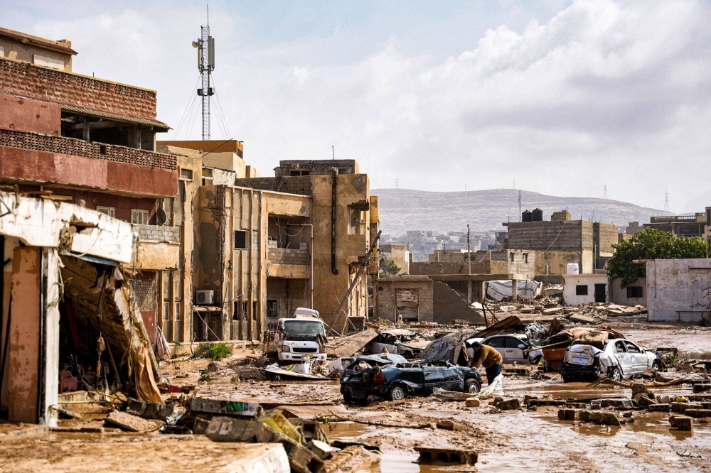 Destroyed vehicles and damaged buildings in the eastern city of Benghazi, Libya, on Monday