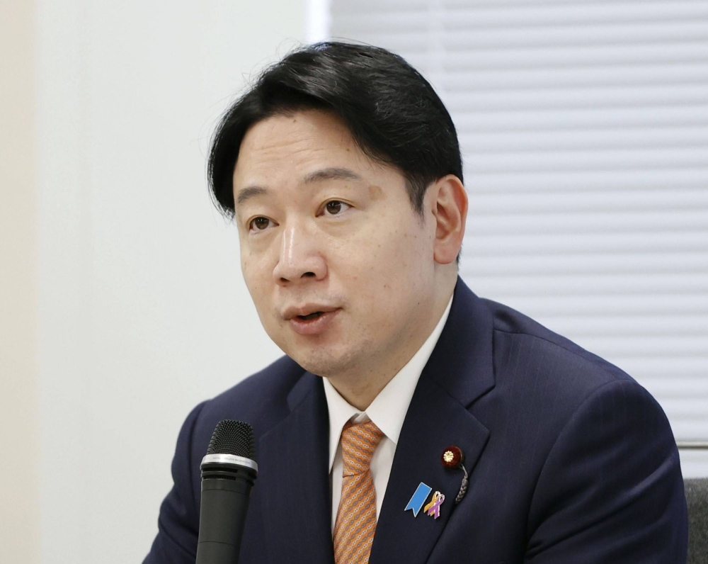 Masanobu Ogura, minister in charge of policies related to children, speaks at a government meeting on measures to prevent suicides among children, in April.
