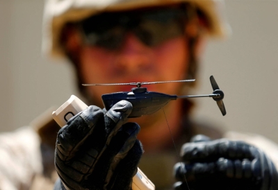 A U.S. Marine shows off a Grp I UAS Black Hornet drone as part of the Rim of the Pacific 2016 exercise at Camp Pendleton, California, in July 2016.