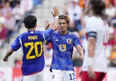 Japan's Keito Nakamura (right) celebrates his second goal against Turkey during an international friendly in Genk, Belgium, on Tuesday.