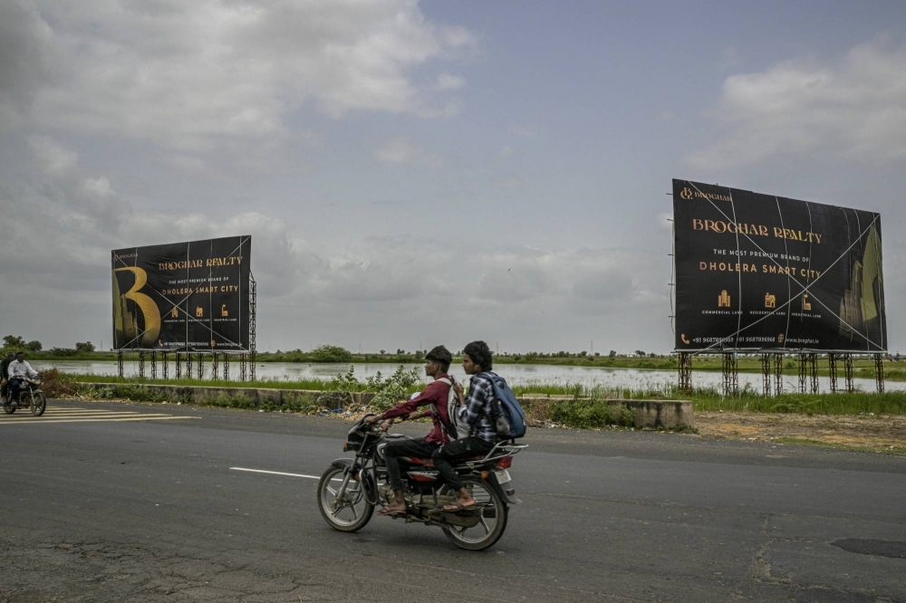 Advertisements for the Dholera Smart City project, which is in the early stages of development, in Dholera, India, on Aug. 25. India’s government, seizing on the world’s desire to reduce reliance on China, is offering billions to build an entire semiconductor ecosystem on vast empty plots.