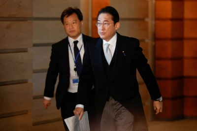 Prime Minister Fumio Kishida leaves his office residence in formal attire to attend an attestation ceremony at the Imperial Palace with his reshuffled Cabinet in Tokyo on Wednesday.