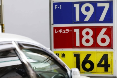 A price board at a gas station in Tokyo shows regular gasoline at ¥186 yen per liter on Aug. 30.