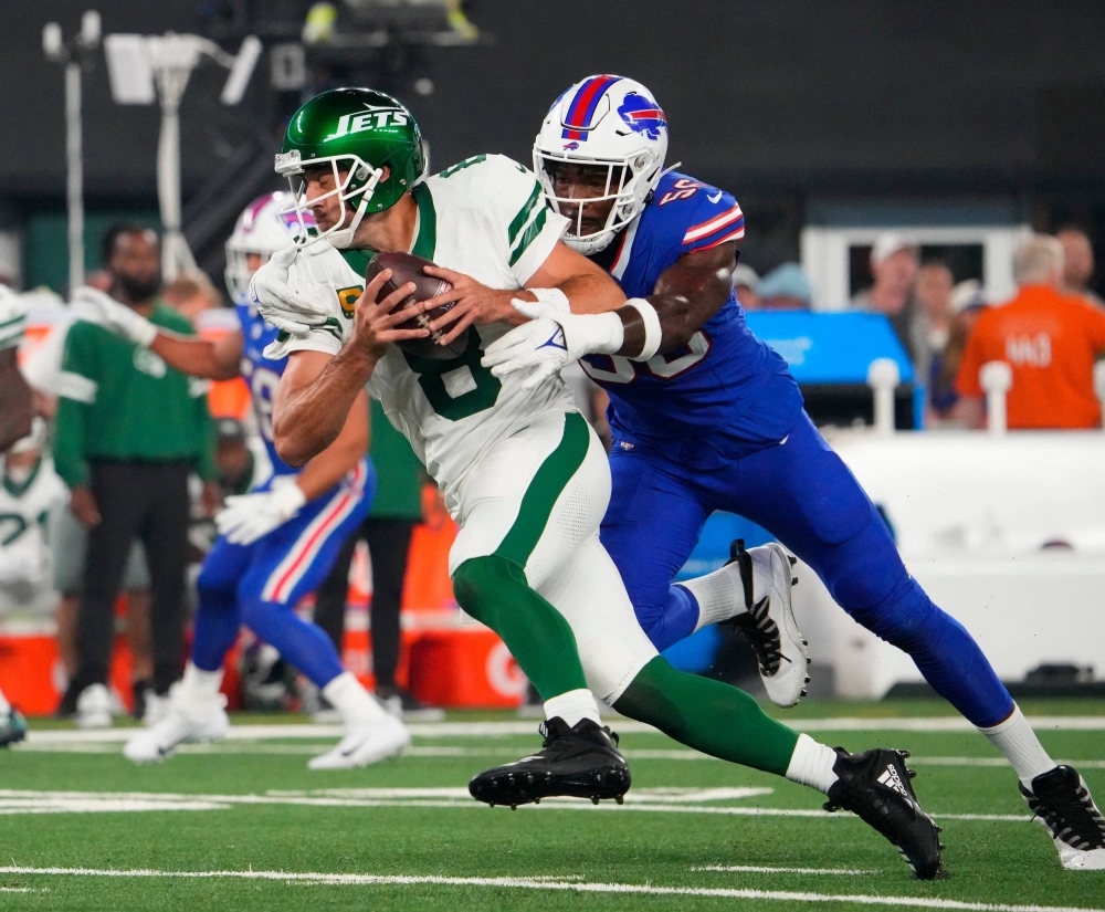 Jets quarterback Aaron Rodgers (left) is sacked by Bills defensive end Leonard Floyd during the first quarter at MetLife Stadium in East Rutherford, New Jersey, on Sunday. Rodgers suffered a torn Achilles on the play.