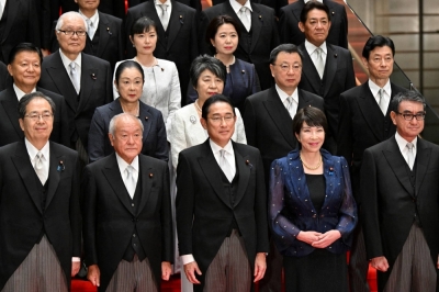 Prime Minister Fumio Kishida poses with his new Cabinet in Tokyo on Wednesday.