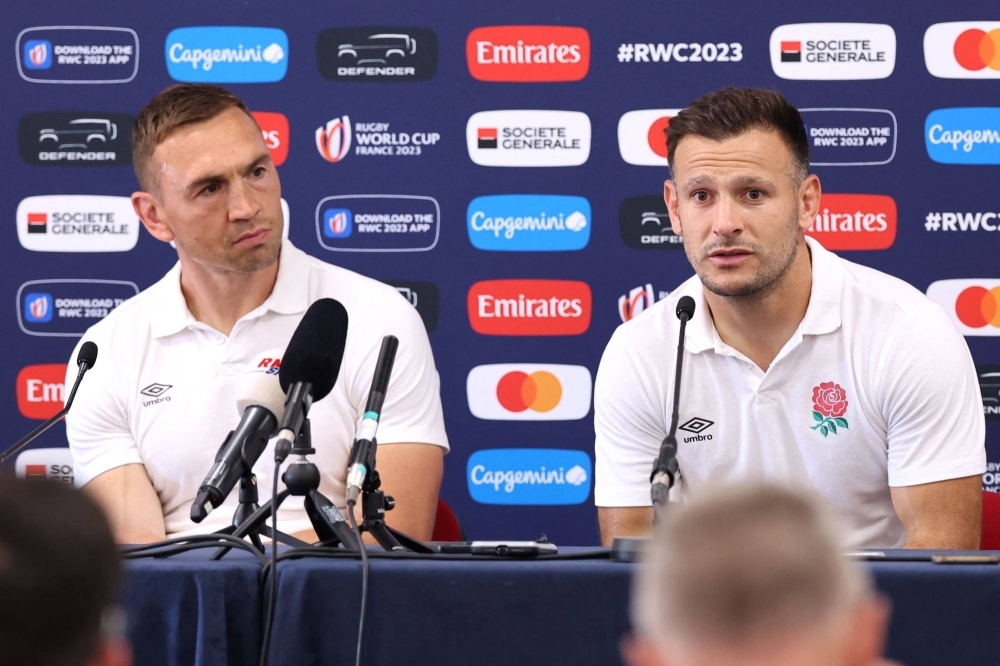 England defense coach Kevin Sinfield (left) and scrumhalf Danny Care speak with reporters during a news conference in Le Touquet-Paris-Plage, France, prior to the Rugby World Cup.