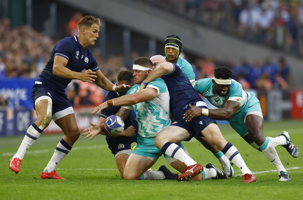South Africa's Malcolm Marx (center) is tackled during a match against Scotland at the Rugby World Cup in Marseille, France, on Sunday.