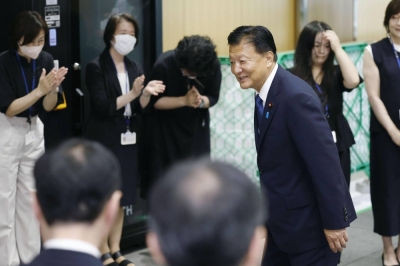Newly appointed economy minister Yoshitaka Shindo arrives at the Cabinet Office on Thursday