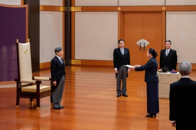 Emperor Naruhito greets newly appointed reconstruction minister Shinako Tsuchiya during the attestation ceremony at the Imperial Palace in Tokyo on Wednesday following Prime Minister Fumio Kishida's Cabinet reshuffle.