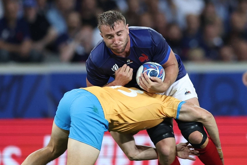 France's Anthony Jelonch is tackled by Uruguay's Tomas Inciarte Rachetti during their Pool A match at the Rugby World Cup in Lille, France, on Thursday.