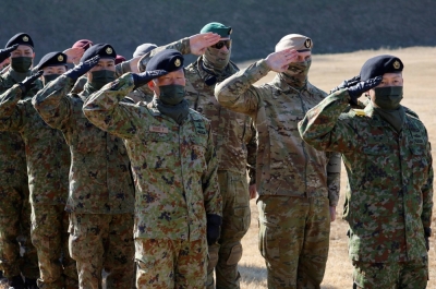 Airborne troops from Japan, U.S., Britain and Australia take part in a joint military drill at the Narashino exercise field in Funabashi, Chiba Prefecture, in January.