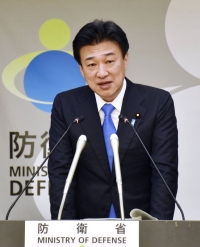 New Defense Minister Minoru Kihara speaks during his first news conference since taking up his post at the Defense Ministry on Wednesday. | KYODO