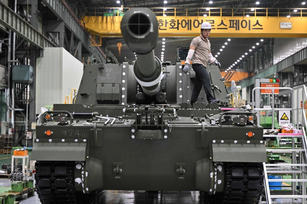 An engineer works on a K-9 self propelled howitzer at Hanwha Aerospace factory in Changwon, South Korea, on Friday.