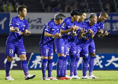 Sanfrecce players celebrate Takaaki Shichi's (third from right) first-half opener against Vissel in Hiroshima on Saturday.
