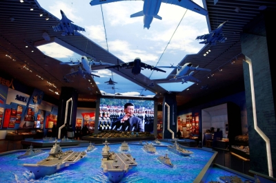 Models of military equipment and a giant screen displaying Chinese leader Xi Jinping are seen at an exhibition at the Military Museum of the Chinese People's Revolution in Beijing last October.