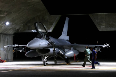A Taiwanese pilot runs toward an F-16V fighter jet for an evening take off as part of a combat readiness mission at the airbase in Hualien, Taiwan, in August last year. 