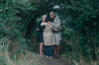 Mia Lee Sorensen with her Danish mother, Lilian Hansen, 72, and father, Bent Hansen, 74, on the coast of Korsor, Denmark, on July 13. South Korean adoptees have been returning to the country to hold the government accountable for what they call a corrupt and predatory adoption system.