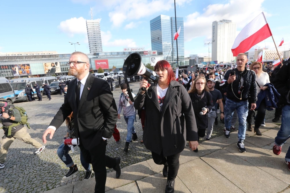 The far-right Confederation Liberty and Independence party rally against measures imposed by the Polish government to stem the spread of COVID-19, in Warsaw in October 2020.