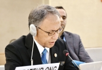 Okinawa Gov. Denny Tamaki speaks at a session of the U.N. Human Rights Council in Geneva on Monday. | Kyodo