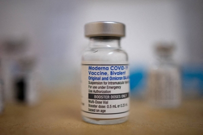 A vial of the Moderna COVID-19 booster vaccine targeting BA.4 and BA.5 omicron subvariants. Japan will roll out an updated version targeting the XBB variant on Wednesday.