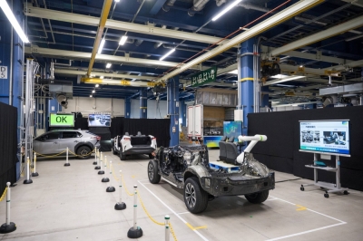 Self-propelled electric vehicles move through the factory floor during a demonstration of its new assembly line technology at Toyota's Motomachi plant in the city of Toyota, Aichi Prefecture, on Sept. 13.