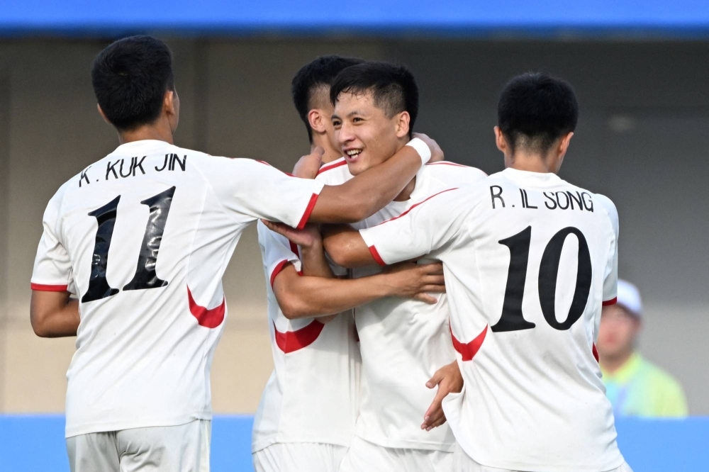 North Korea's Ri Jo Guk (center) celebrates his goal against Taiwan in the men's soccer competition of the Asian Games in Jinhua, China, on Tuesday.
