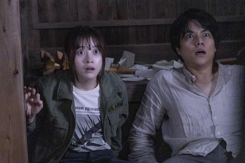 A TV director (Kanna Hashimoto, left) is haunted by the dead wife of an old office crush (Daiki Shigeoka) in “The Forbidden Play.”