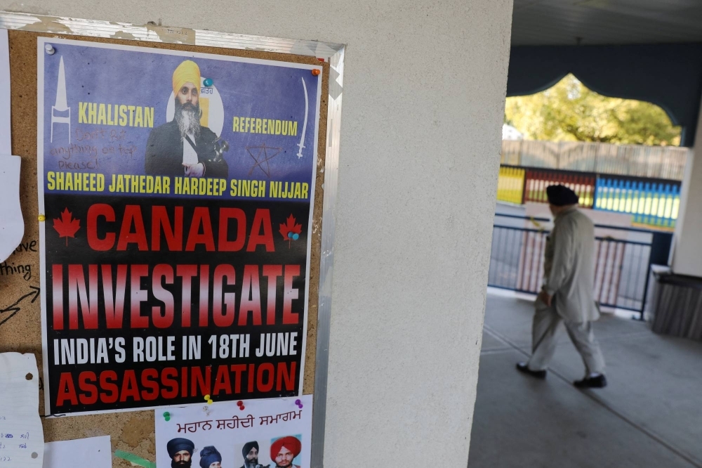 A sign asking for an investigation into India's role in the killing of Sikh leader Hardeep Singh Nijjar is seen at the Guru Nanak Sikh Gurdwara temple in Surrey, British Columbia, Canada, on Wednesday.