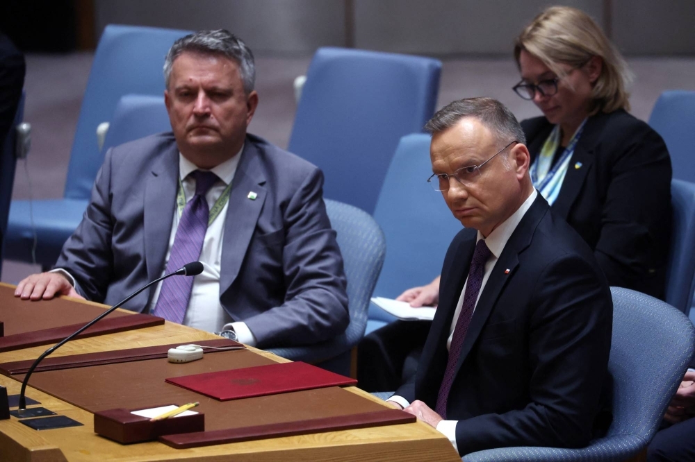Poland's President Andrzej Duda sits next to Ukraine’s  Ambassador to the United Nations Sergіy Kyslytsya during a ministerial level meeting of the U.N. Security Council on the crisis in Ukraine in New York on Wednesday. 