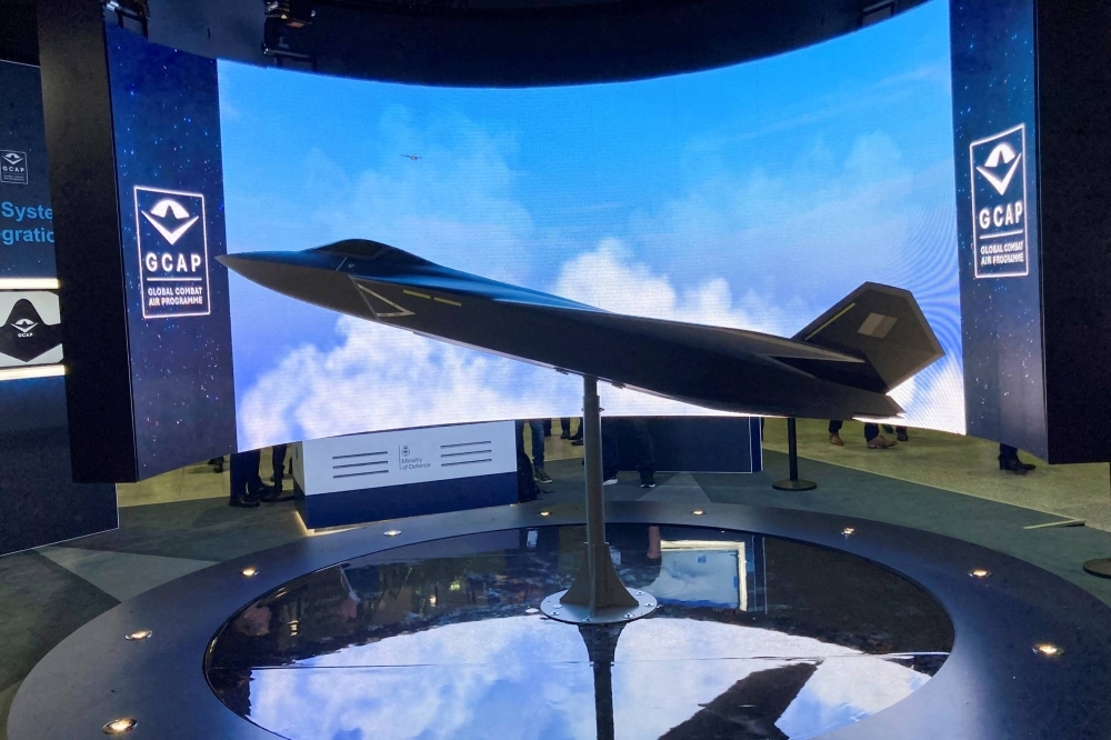 A model of a new fighter jet of the Global Combat Air Programme led by Britain, Japan, and Italy, is seen at the DSEI defense event in London on Sept. 12.