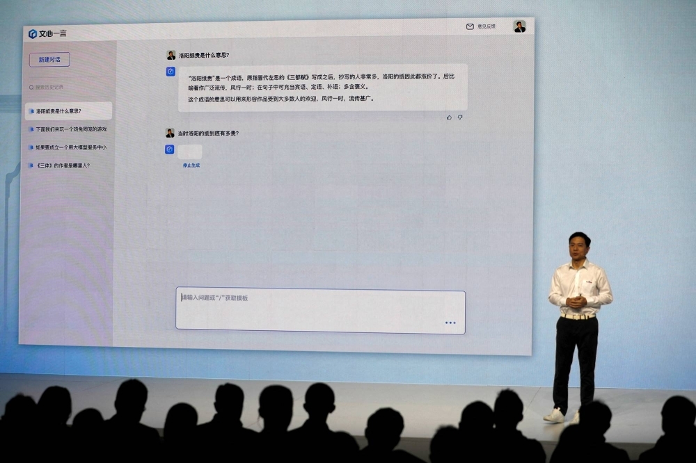 Baidu's co-founder and CEO Robin Li showcases an artificial intelligence chatbot known as Ernie Bot, during a news conference at the company's headquarters in Beijing in March