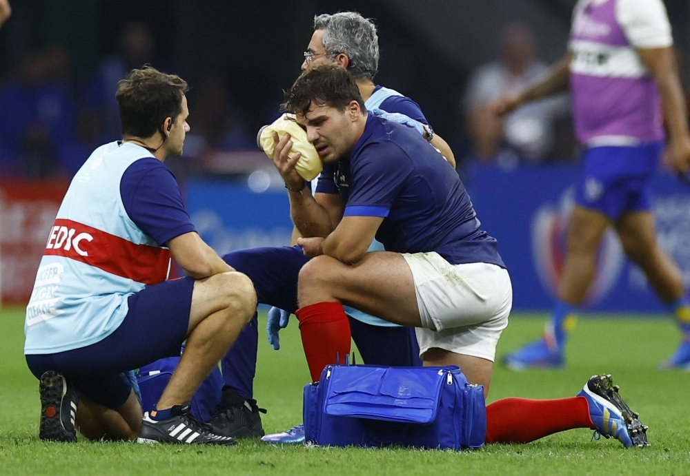 France's Antoine Dupont receives medical attention after sustaining an injury during the team's 96-0 victory over Namibia in the 2023 Rugby World Cup, in Marseille, France, on Thursday.