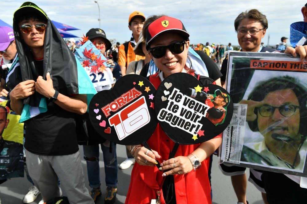 A fan supports Ferrari driver Charles Leclerc in the Suzuka Circuit fan zone on Friday.