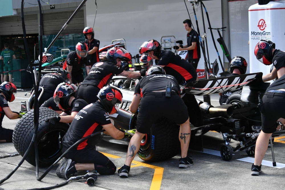 Haas pit crew members train on Friday morning.