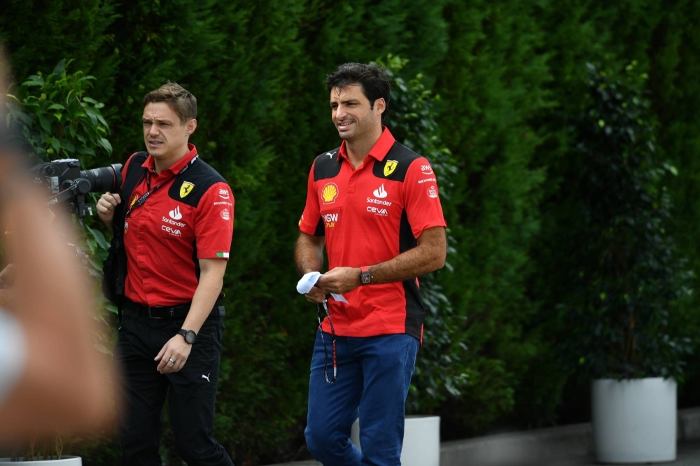 Ferrari driver Carlos Sainz arrives at the Suzuka Circuit paddock on Friday morning.