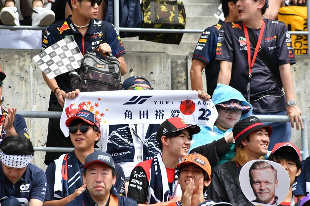 Fans of Tsunoda ahead of the start of the race. 