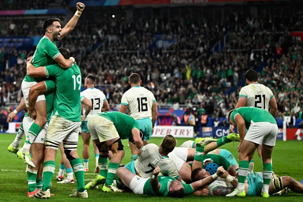 Ireland's scrum-half Conor Murray (far left) celebrates victory at the end of the 2023 Rugby World Cup Pool B match against South Africa at the Stade de France in Saint-Denis, on the outskirts of Paris, on Saturday.