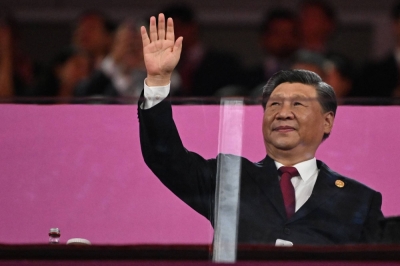 Chinese leader Xi Jinping waves during the opening ceremony of the 2022 Asian Games at the Hangzhou Olympic Sports Center Stadium in Hangzhou, China, on Saturday.