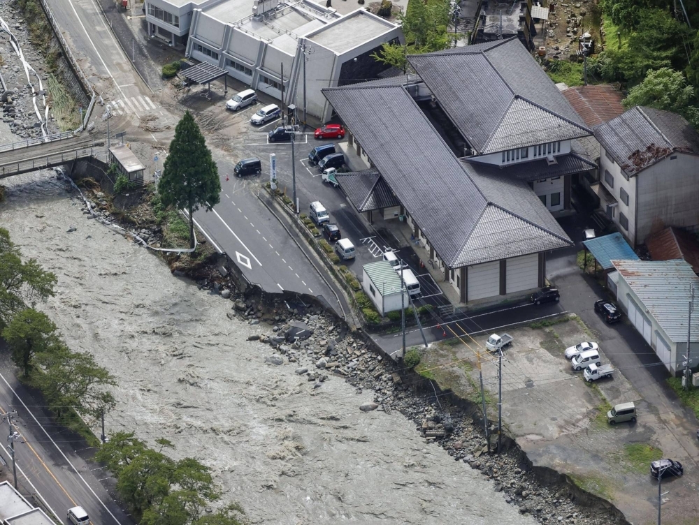 A collapsed road near the Saji River in Tottori Prefecture after Typhoon Lan hit the region in August