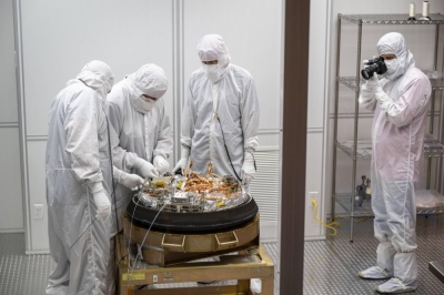 Technicians open NASA's OSIRIS-REx capsule in a clean room at a U.S. military facility in Utah on Sunday.