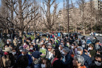 People take part in a protest against the Tokyo Metropolitan Government's redevelopment project for the Meiji Jingu Gaien district in Tokyo in February.