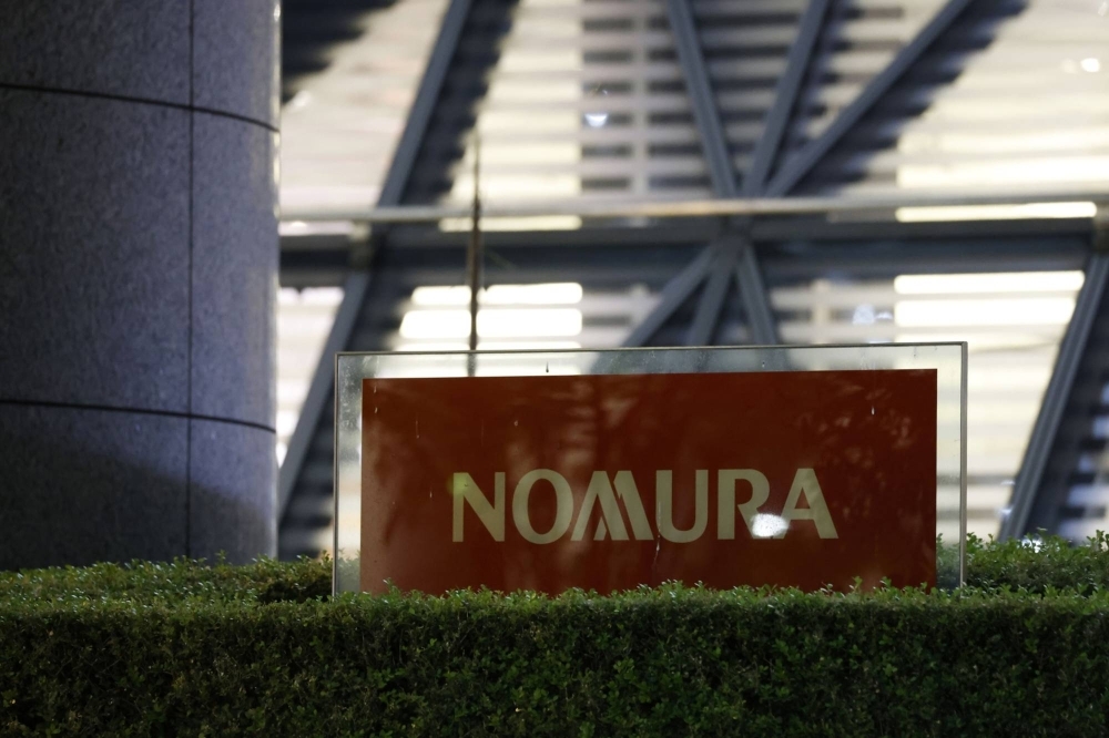 Charles Wang Zhonghe, a senior banker at Nomura Holdings, has reportedly been barred from leaving China in a move connected to a long-running investigation of a top dealmaker in the country.