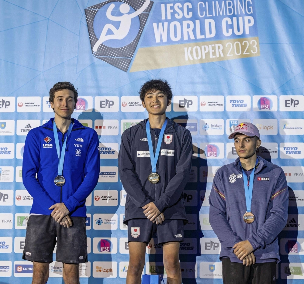 Winner Sorato Anraku (center), second-place Shion Omata (left) and third-place Taisei Homma stand on the podium of the men's final at a sport climbing lead World Cup event in Wujiang, China, on Sunday.