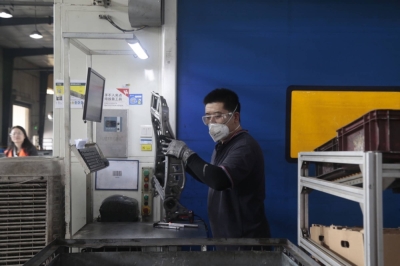 A worker in a factory that makes seats for BMW in Shenyang, China, on Sept. 11. China, facing an economic slump, wants to make its industrial northeast more productive, turning to policies that some economists say have outlived their time. 