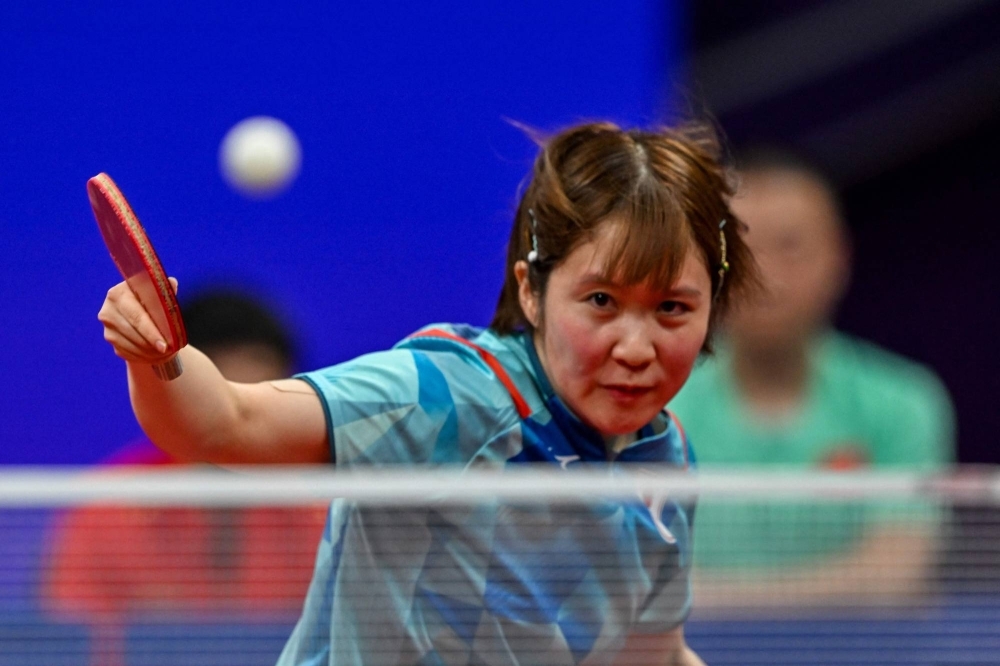 Japan's Miu Hirano hits a return against China's Chen Meng in the table tennis women's team final at the 2022 Asian Games in Hangzhou, China, on Tuesday.