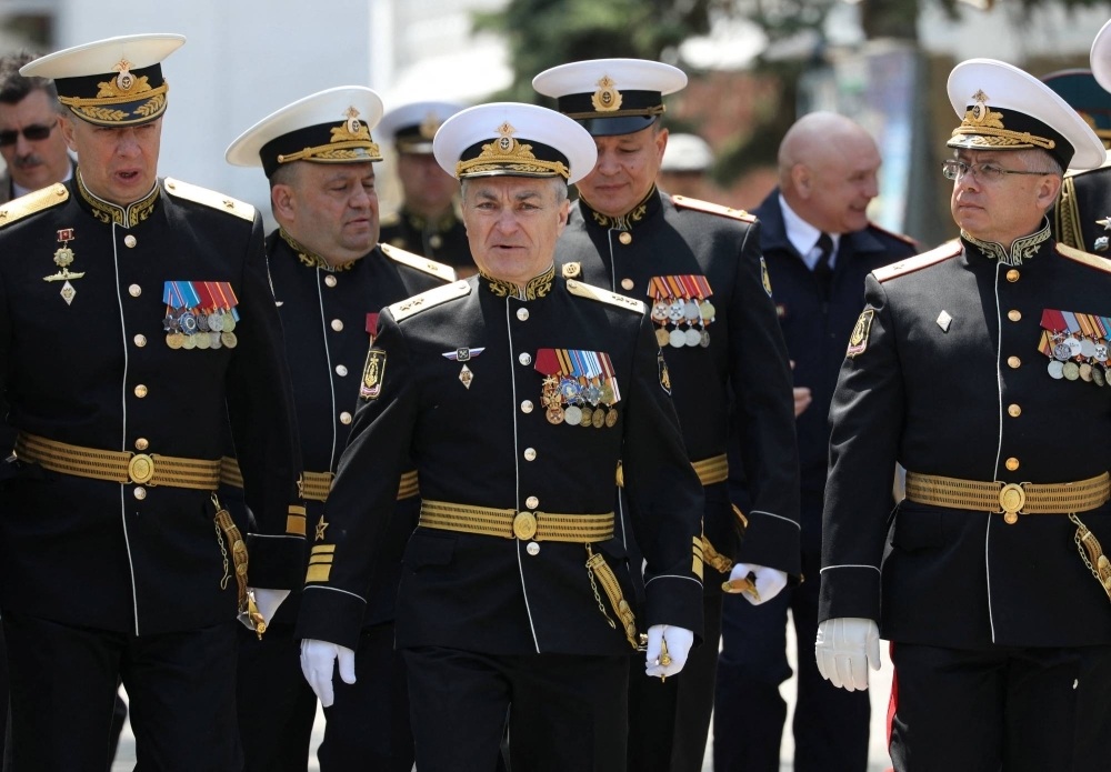 Commander of the Russian Black Sea Fleet Vice-Admiral Viktor Sokolov (center) attends a ceremony marking 240th anniversary of Russia's Black Sea Fleet in Sevastopol, Crimea, on May 13.