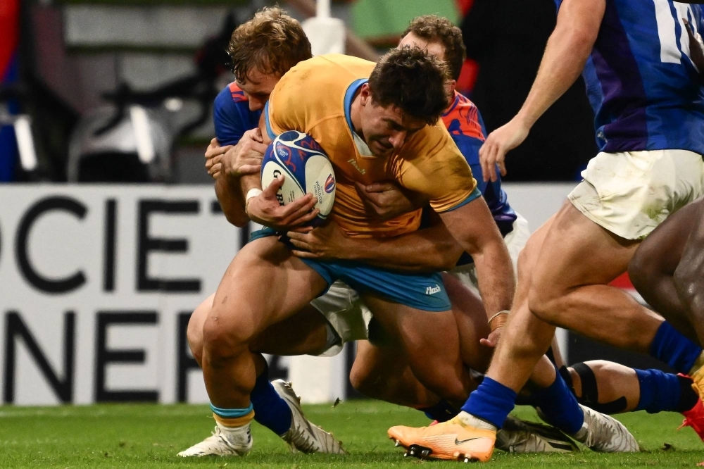 Uruguay's Felipe Arcos Perez is tackled during his team's Pool A match against Namibia at the Rugby World Cup in Lyon, France, on Wednesday. 